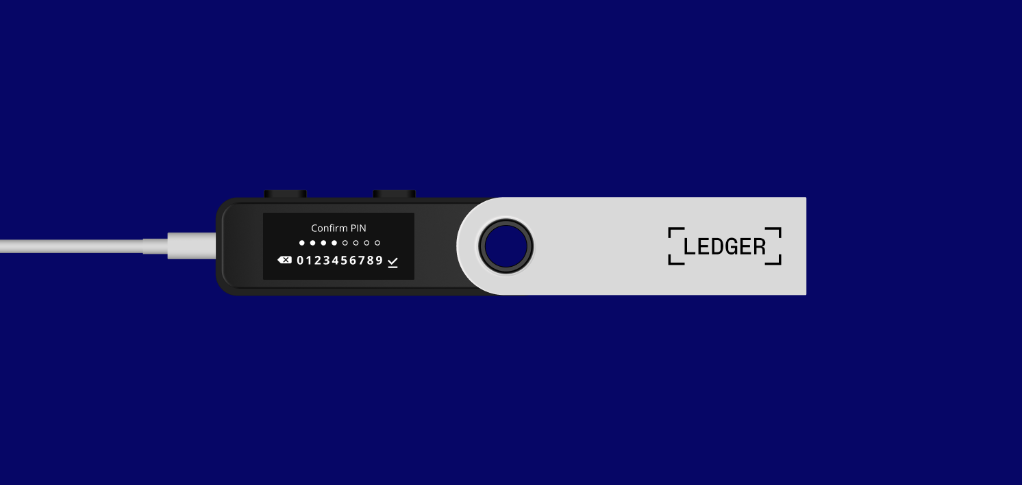 Ledger hardware wallet connected via USB, showing the PIN entry screen on its display.